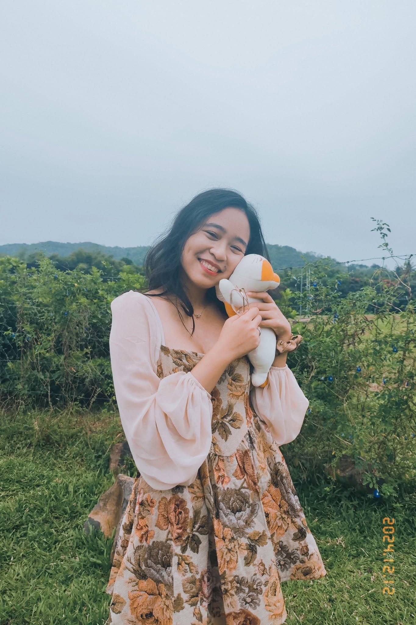 Krystal, smiling outdoors
