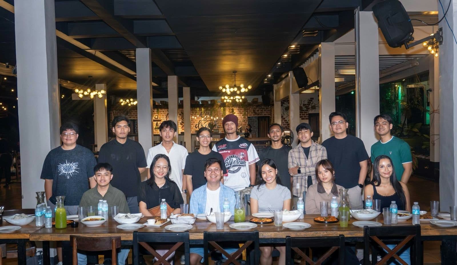 The Zen Companies PH team at a long dinner table, smiling for a group photo